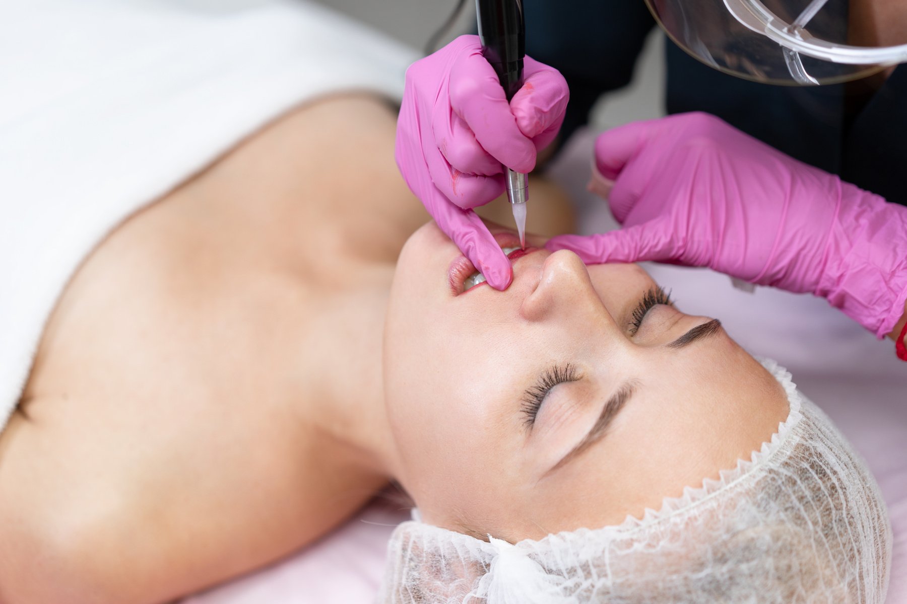 Woman Getting Permanent Lip Tattoo